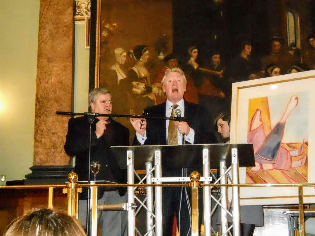 A work held up at the lectern during the charity auction.