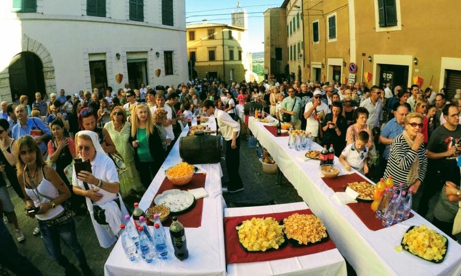 Long tables laid through the piazza for the summer feast in Chianciano Terme.