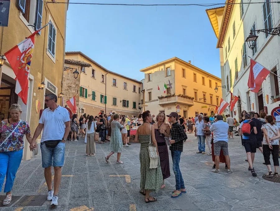 The street through Chianciano’s old town, flags overhead in the evening.