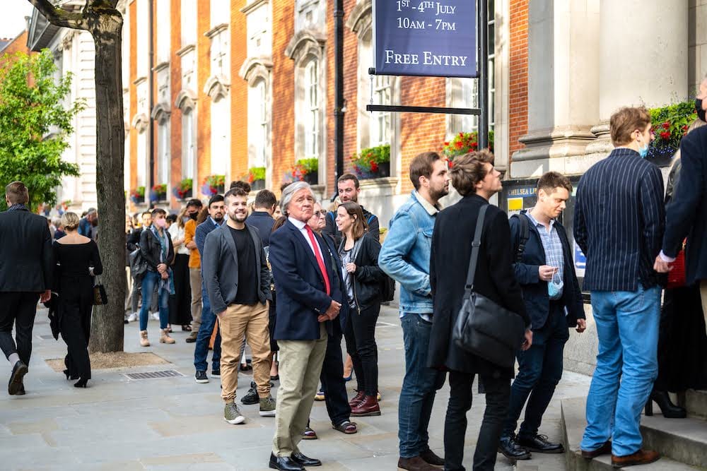 The queue outside Chelsea Old Town Hall under the Free Entry banner.