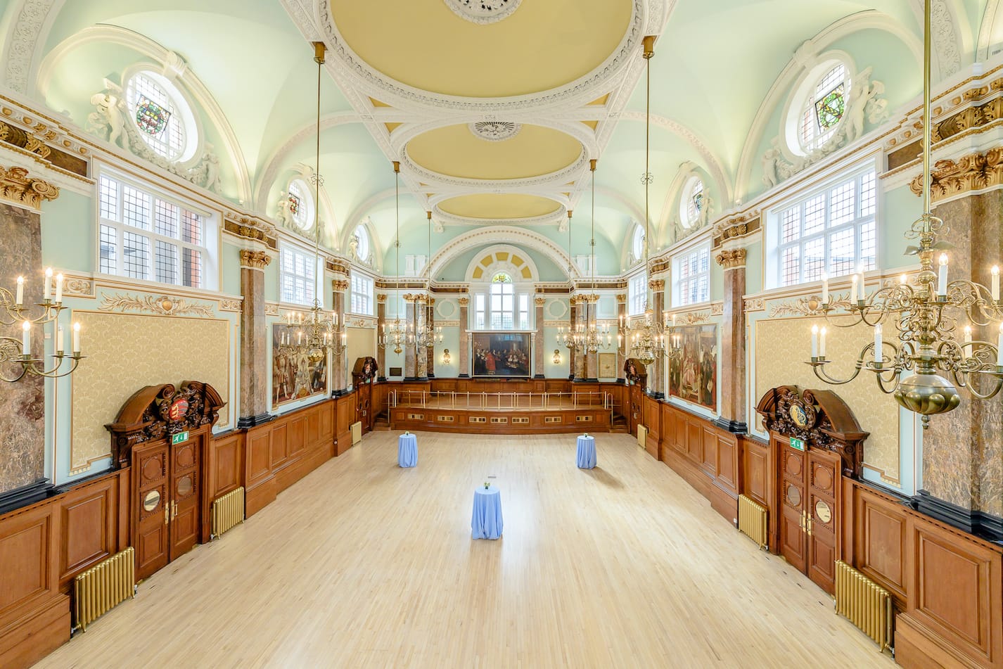 The Main Hall of Chelsea Old Town Hall, empty, its parquet clear from stage to balcony.